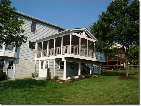 Custom Composite deck and room with a shed built under the deck by Nevins Construction.