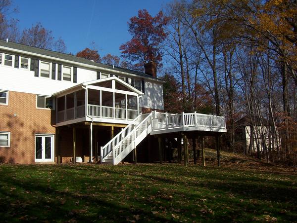 Beautiful multi-level deck with screen room and composite steps , railing and balusters.