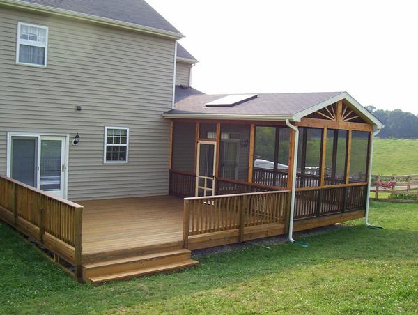 Nevins Construction built a wooden deck with a screen room with vaulted ceilings and a skylight